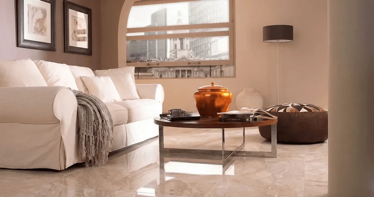 Modern living room with professionally installed marble flooring, a beige sofa, coffee table in Buffalo, NY
