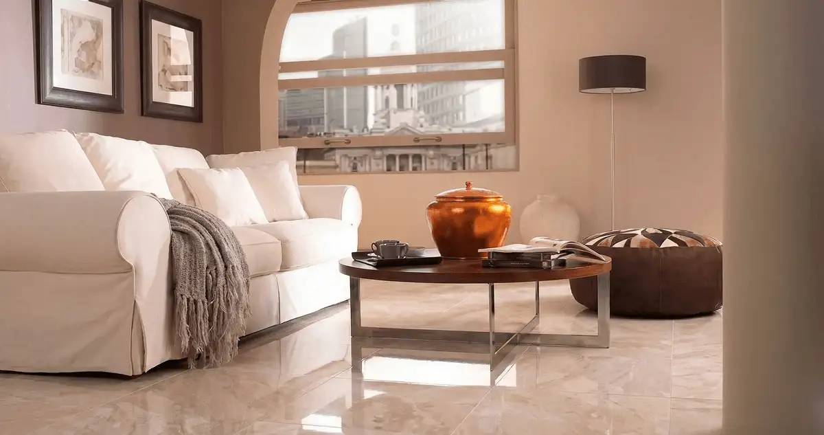 Modern living room with professionally installed marble flooring, a beige sofa, coffee table in Buffalo, NY