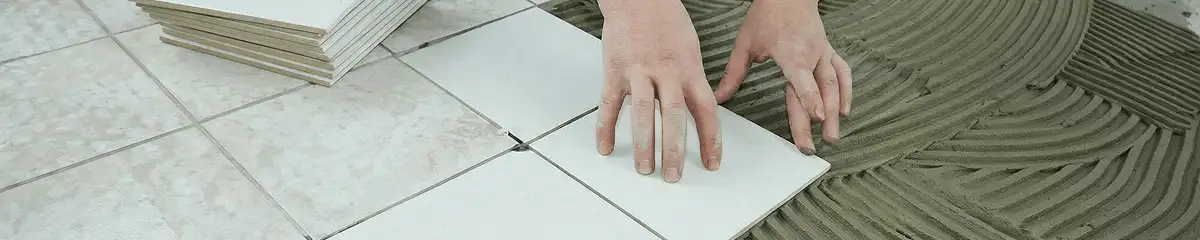 Professional installing white tile floors in Buffalo, NY