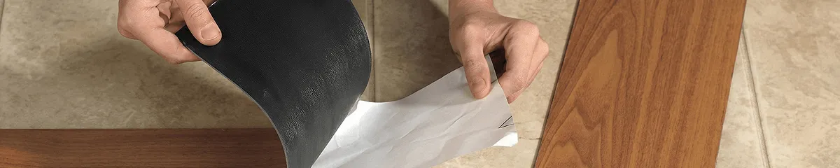 A professional installing vinyl flooring in Buffalo, NY
