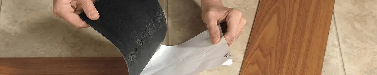 A professional installing vinyl flooring in Buffalo, NY